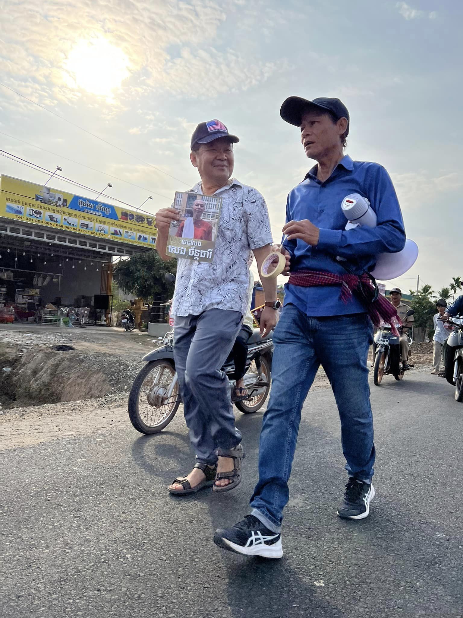 Senator Mardi Seng walking at a civic gathering in Cambodia